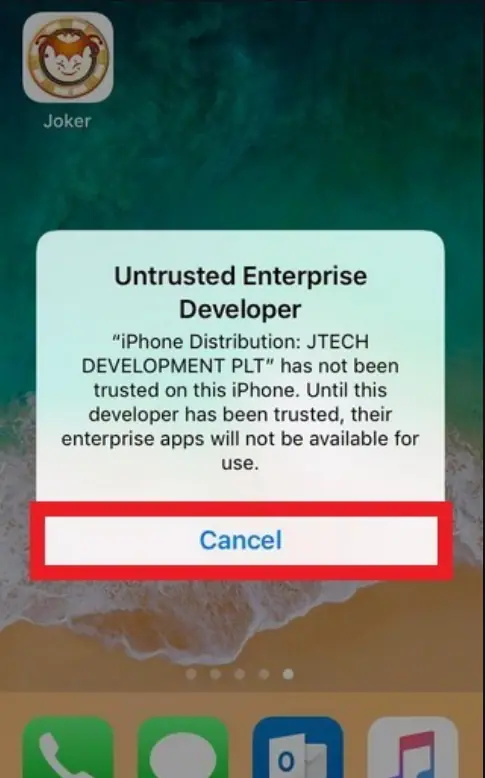 iOS warning Untrusted Enterprise Developer over a home screen with a Joker app icon, naming the distribution certificate, with the Cancel button highlighted